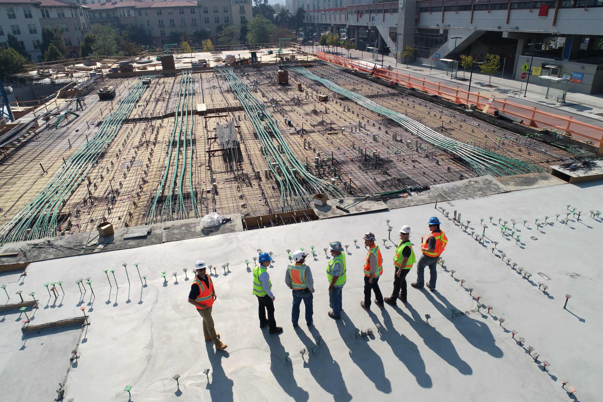 How does Harmon Inc manage their safety programs?
